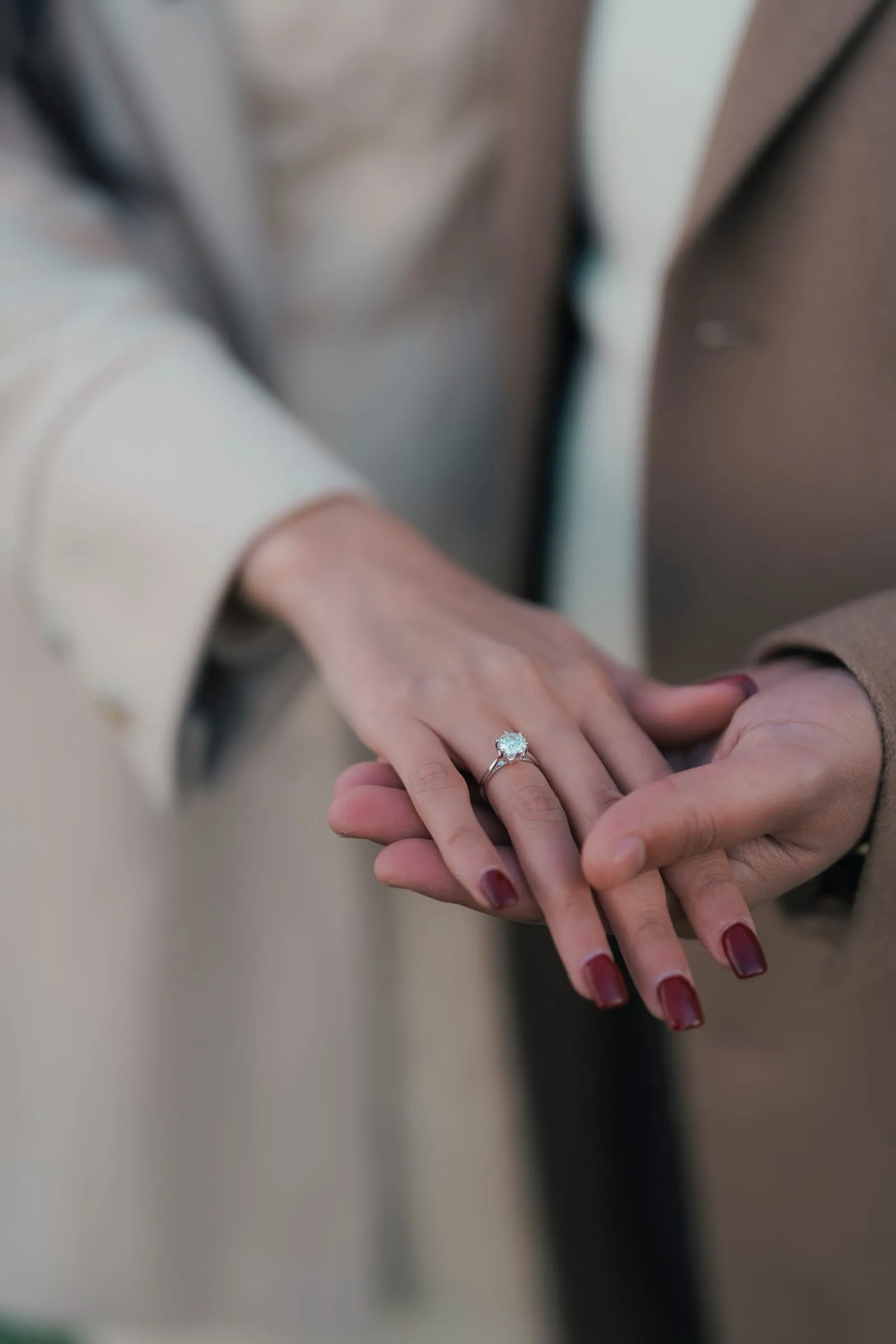 Close-up of Merona's ring hand resting on Abanoub's hand