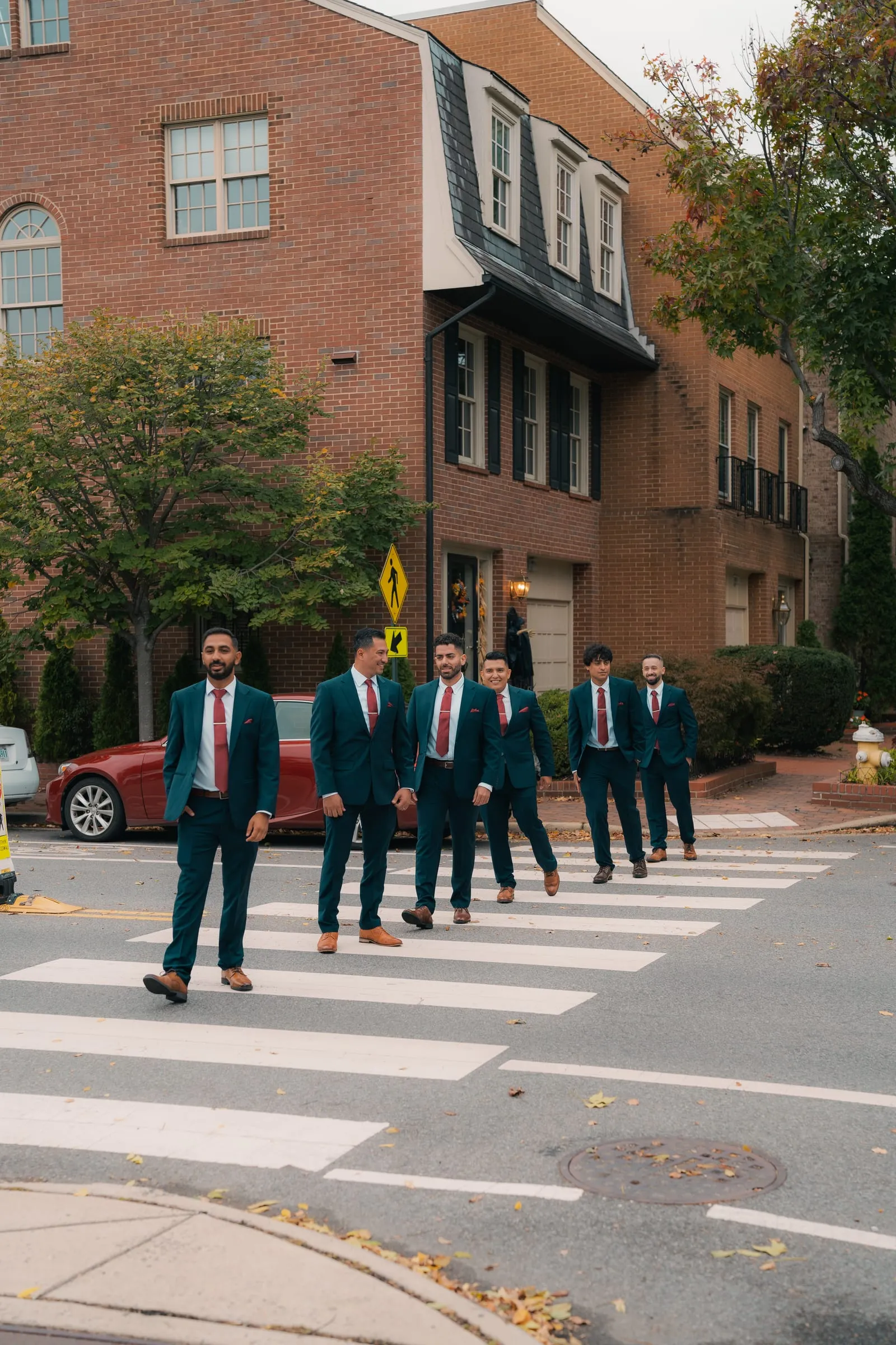 Mina's groomsmen crossing a crosswalk together before the wedding