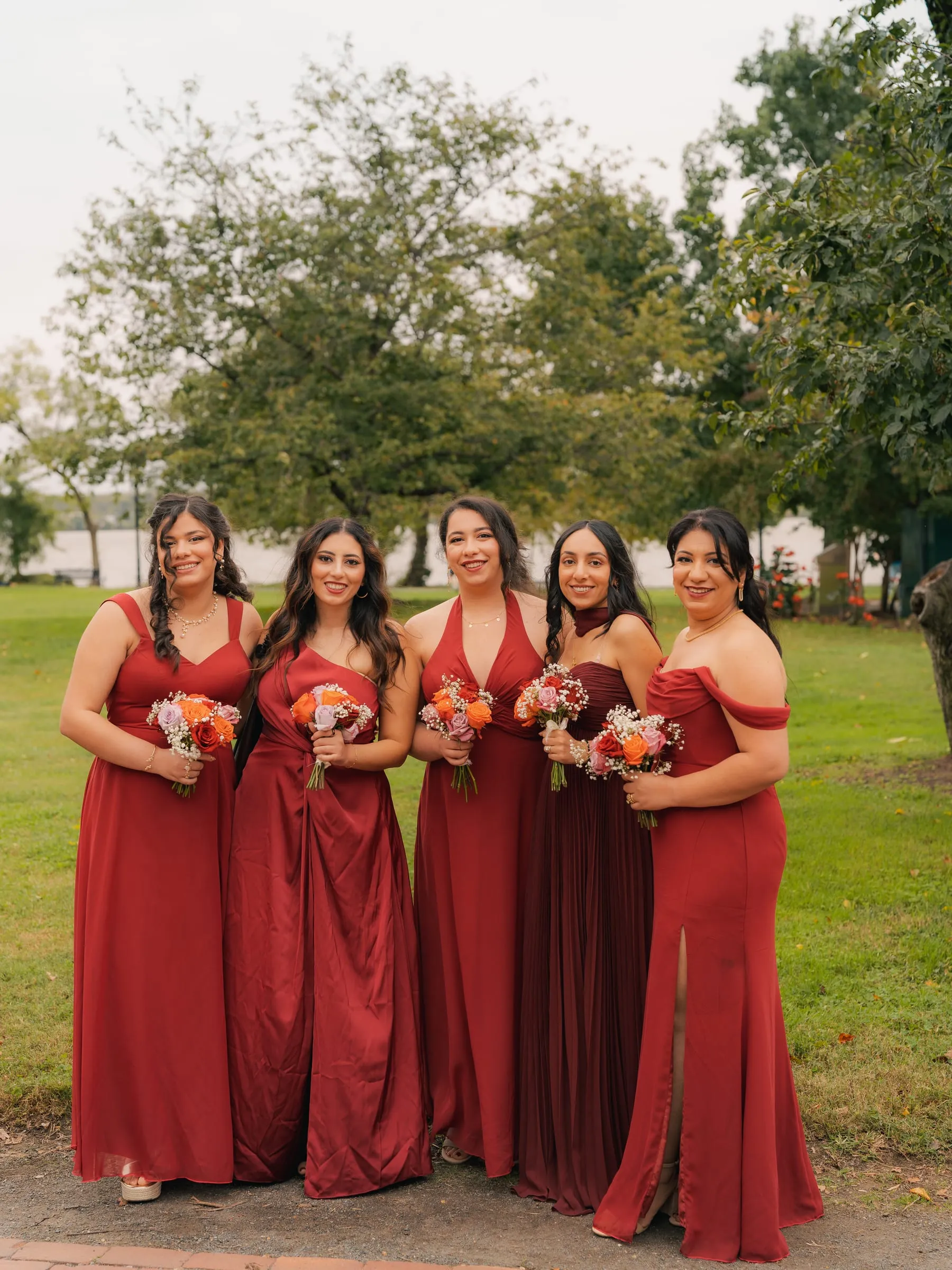 The bridesmaids gathered together with their bouquets before the ceremony