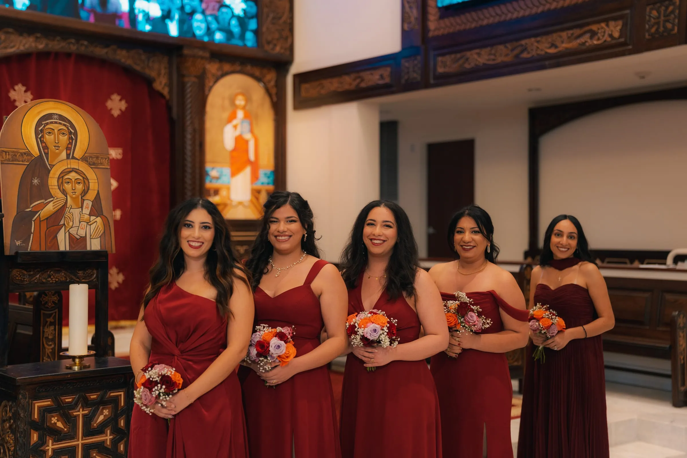 The bridesmaids standing before the altar icons inside St. Mark Coptic Orthodox Church of Washington DC