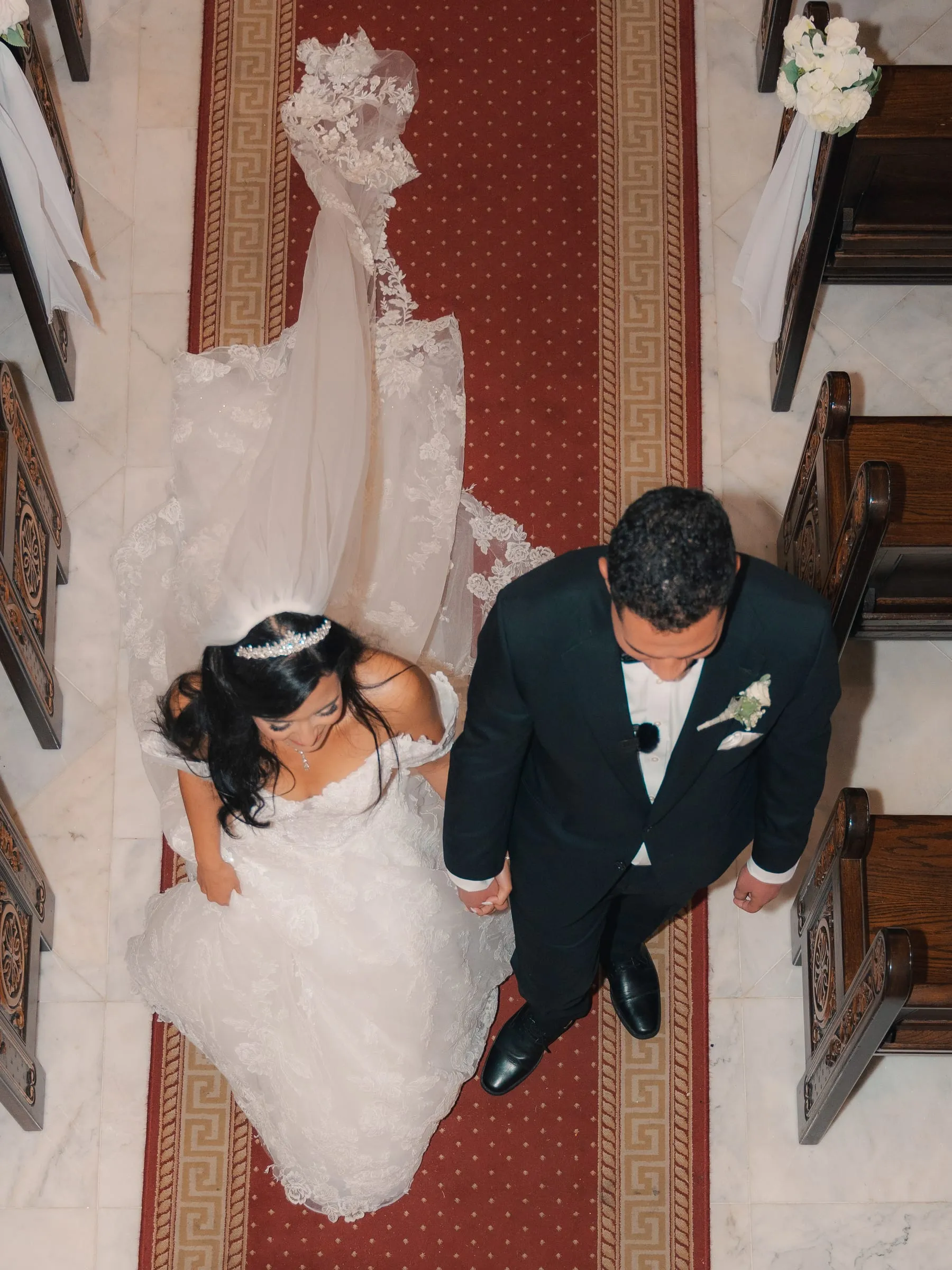 An overhead view of the newly married couple walking down the aisle together