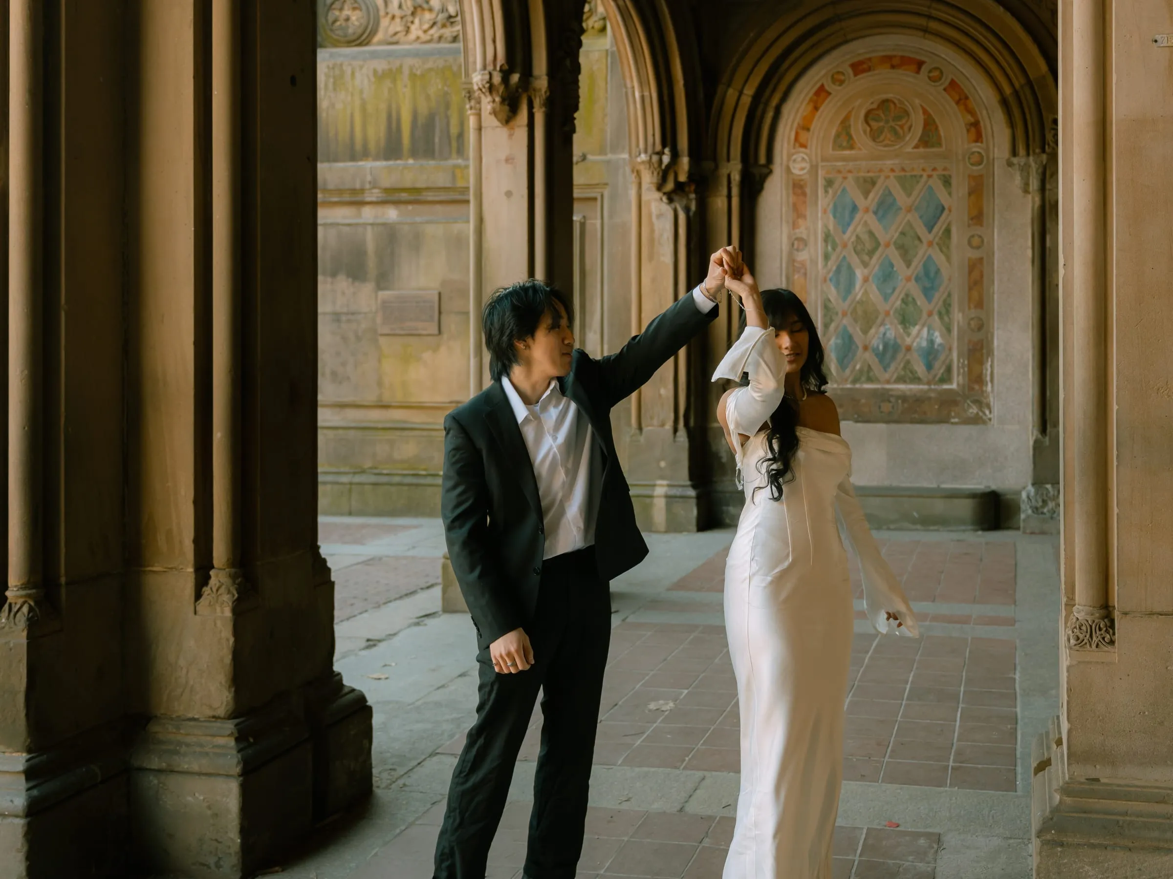 Nathan twirling Noushin in the Bethesda Terrace arcade