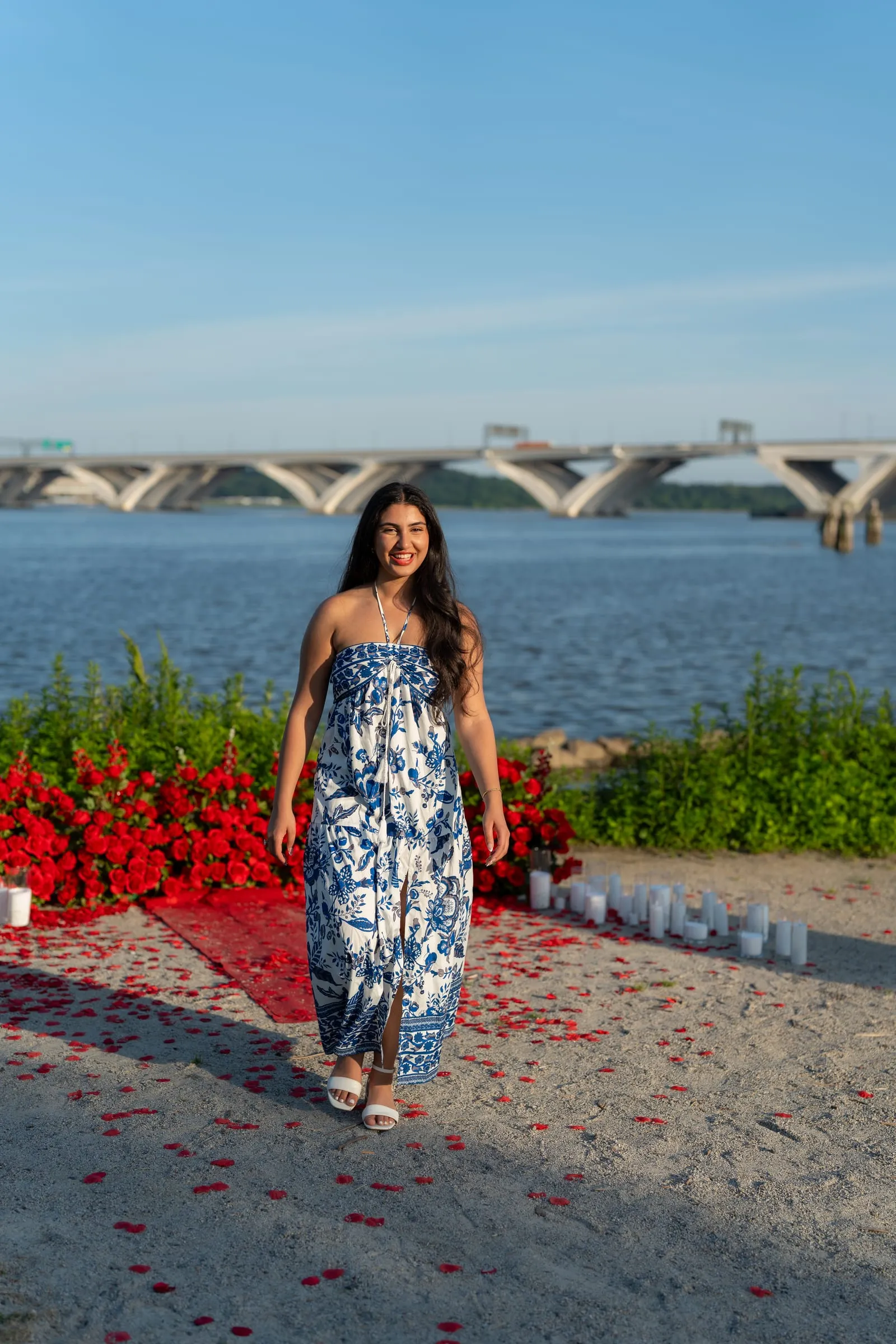 Verina walking along the rose petal path after the proposal